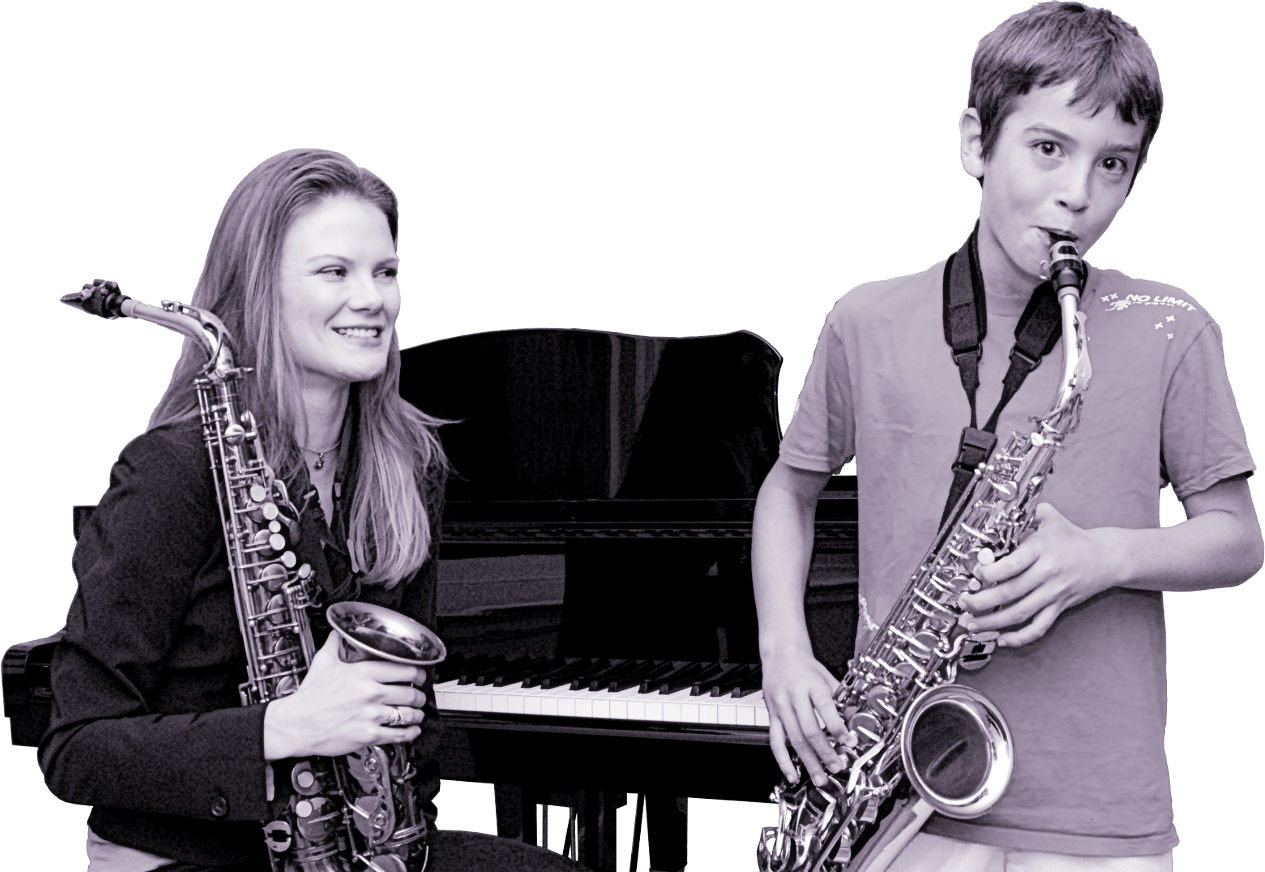 Stephanie at piano with student.